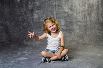 rock girl sitting on the floor