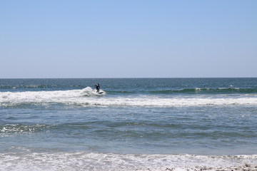 Surfer on a wave at the beach