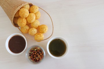 Panipuri or Golgappa. Indian street snack made of fried mint flavors puries, mint chutney, sprouts and dates, tamarind chutney. Indian Chat.