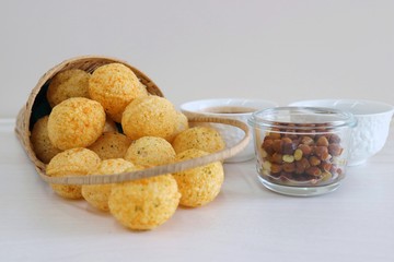 Panipuri or Golgappa. Indian street snack made of fried mint flavors puries, mint chutney, sprouts and dates, tamarind chutney. Indian Chat.
