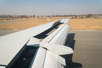 airplane wing with open flaps