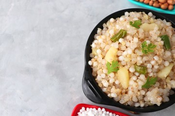 Indian Food dish made out of Sago called Sabudana khichdi, Usually eaten during fasting days. Recipe Ingredients along with copy space