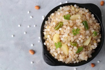 Indian Food dish made out of Sago called Sabudana khichdi, Usually eaten during fasting days. Recipe Ingredients along with copy space