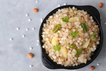 Indian Food dish made out of Sago called Sabudana khichdi, Usually eaten during fasting days. Recipe Ingredients along with copy space