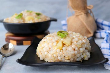 Indian Food dish made out of Sago called Sabudana khichdi, Usually eaten during fasting days. Recipe Ingredients along with copy space