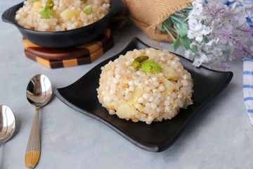 Indian Food dish made out of Sago called Sabudana khichdi, Usually eaten during fasting days. Recipe Ingredients along with copy space