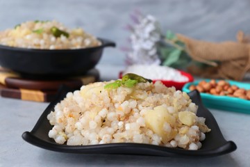 Indian Food dish made out of Sago called Sabudana khichdi, Usually eaten during fasting days. Recipe Ingredients along with copy space