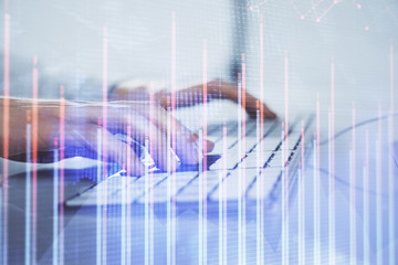 Forex graph with businessman working on computer in office on background. Concept of hardworking. Closeup. Multi exposure.