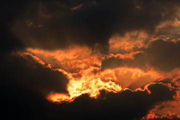 Fototapeta na wymiar orange sky or blast sky or The explosion cloud sky or Spiritual sun rays through the clouds or Optimistic sunset rays