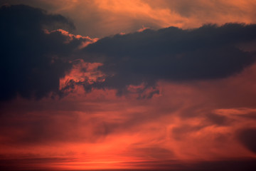 Sunlight penetrating through the clouds in the colorful sky