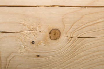 The surface of the processed wooden beam close-up.