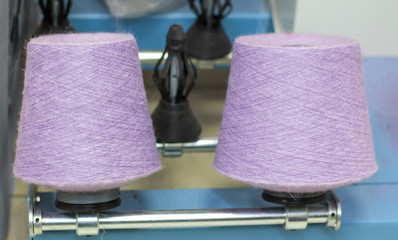 two Babin lilac threads on a modern machine for twisting threads in production