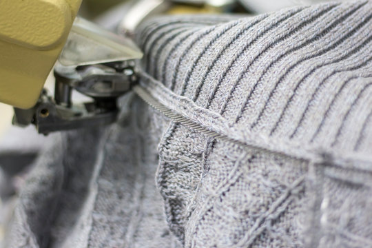 modern machine for connecting knitted parts in the process of work