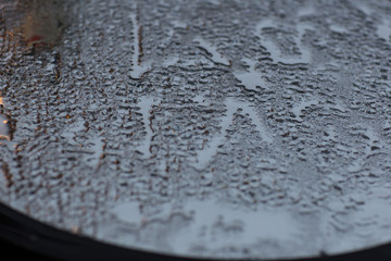 drops of water on glass close up 