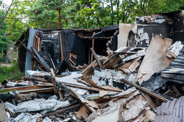 Charred and blackened remains of building destroyed by a fire