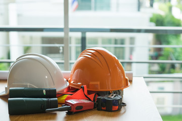 Architect desk ,Business,engineering concept, architecture concept. two helmet on the table, soft focus