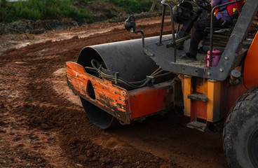 Road rollers working on the new roads construction site. Heavy duty machinery working on highway....