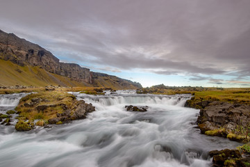 Fototapeta premium Unknown small waterfall and no people seen from nearby, Iceland