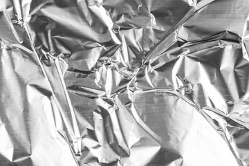 Close up of aluminium foil crumpled. Silver aluminium foil texture background. Abstract metallic...
