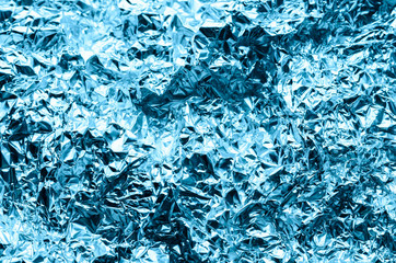 abstract wrinkled aluminum foil, background for christmas decoration, shallow depth of field
