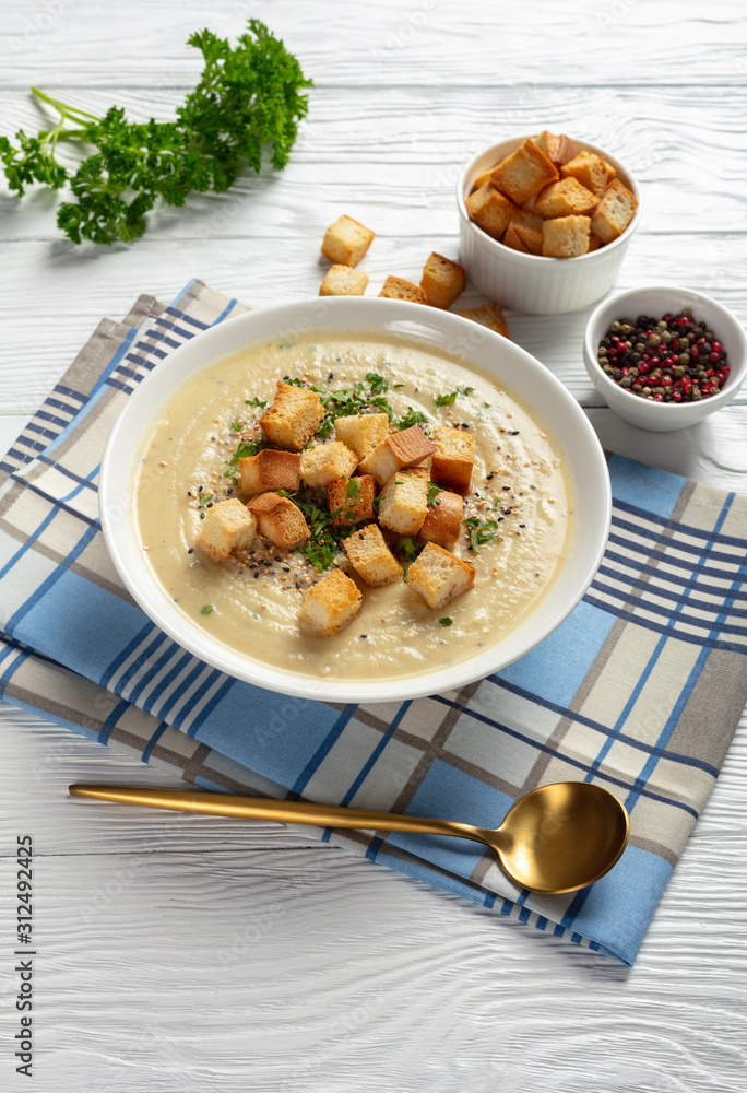 Poster Asiago Roasted Garlic Cauliflower Soup in a bowl