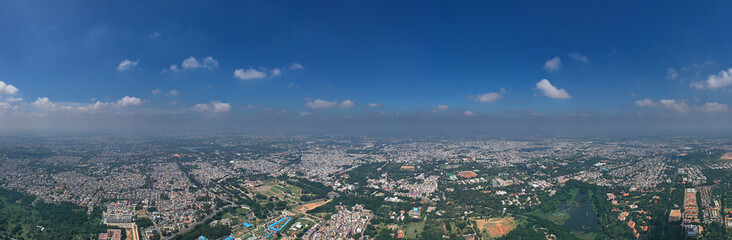 Panoramic Cityscape aerial view of urban areas against clear blue sky, india.