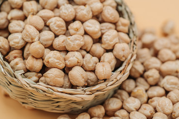 Healthy organic dried chickpeas in a straw basket