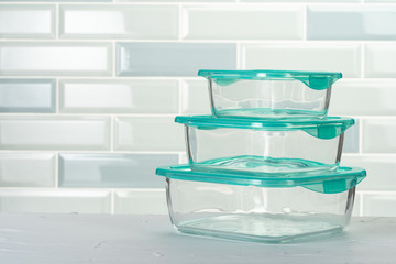 Set of plastic boxes kitchen ware on kitchen counter