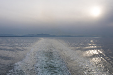 peaceful mystic mountain and ocean view near coast in twilight at the evening , foggy landscape