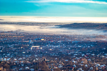 Morning city in the fog