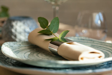 Stylish serving on a green ceramic plate  with cotton napkin