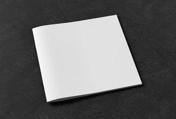 Square brochure or booklet cover mock up on black background. Isolated with clipping path around...