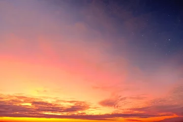 Tuinposter Orange sky at sunset and red clouds landscape against bright star on black universe background. Wide panorama view of stars in space nature at dark time. Starry night at night wallpaper © vaalaa
