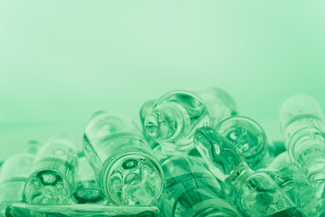 Glass medical ampoule vial for injection. Medicine is liquid sodium chloride with of aqueous solution in ampulla. Close up. Bottles ampule multicolor on background color and water. Human plasma.