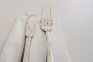 Close-up of cutlery and napkin on table