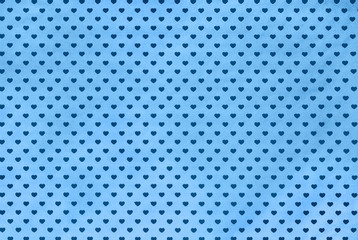 Gift wrapping paper with blue hearts, background. Color of the year 2020 Classic Blue toned