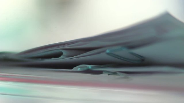 Macro of documents, papers, stack of papers, staples.