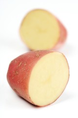 Close up of red potato on white backround