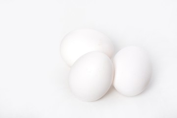 Three eggs on white background