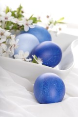 Blue easter eggs in bowl