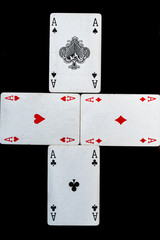 some cards for playing cards games and gambling on a black background