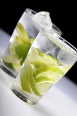 Studio shot of drinks with lime slices
