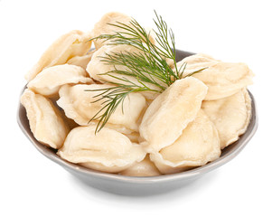 Bowl with tasty dumplings on white background