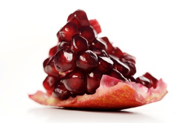 Studio shot of pomegranate fruit