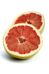 Halved grapefruit on white background