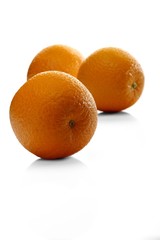 Oranges on white background - close-up