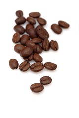 Coffee grains on white background