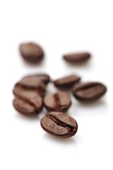 Coffee grains on white background