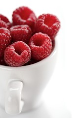 Raspberries in white cup - close-up