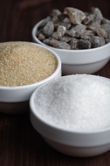 White and brown sugar in bowls